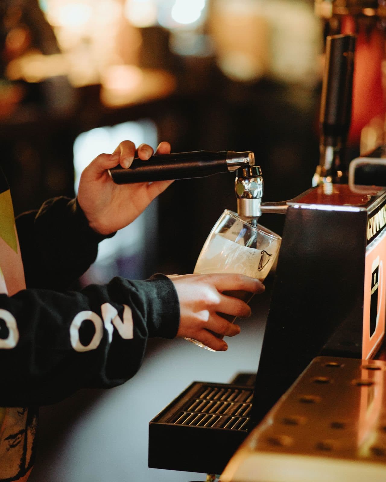 Guinness being poured at the bar